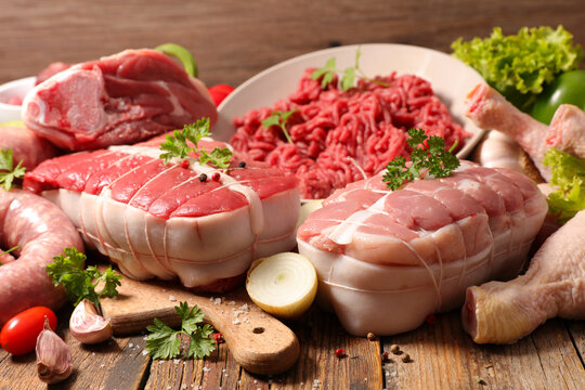 assorted of raw meats ( minced beef,  roast beef,  chicken, sausage and sirloin)