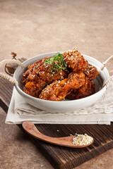 Korean Fried Chicken Yangnyeom Tongdak with Spicy Sauce and Sesame Seed. Sayap ayam pedas Korea.
