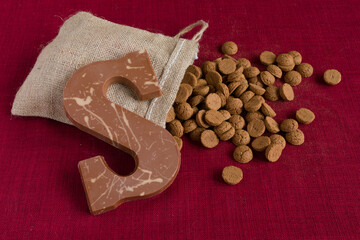 Dutch Sinterklaas tradition: A chocolate letter and a bag with candy called Pepernoten.