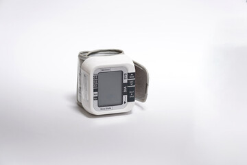 wrist blood pressure monitor on white background