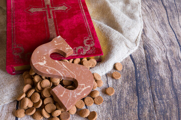 Dutch Sinterklaas tradition: A chocolate letter a book, a bag and candy called Pepernoten.