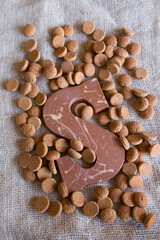 Dutch Sinterklaas tradition: A chocolate letter and candy called Pepernoten.