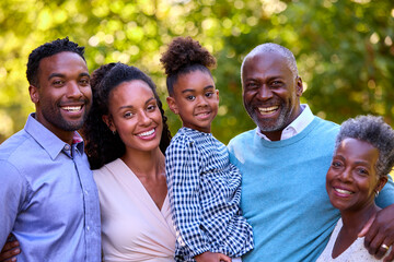 Portrait Of Multi-Generation Family Enjoying Walk In Countryside Together