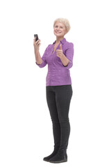 in full growth. smiling mature woman with a smartphone .