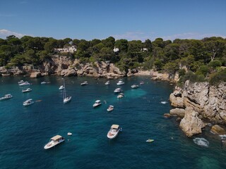Aerial view of Cap d'Antibes and  Billionaire's Bay. Beautiful rocky beach near coastal path on the Cap d'Antibes, Antibes, France. Drone view from above of C&ocirc;te d&rsquo;Azur near Juan-les-Pins and Cannes.