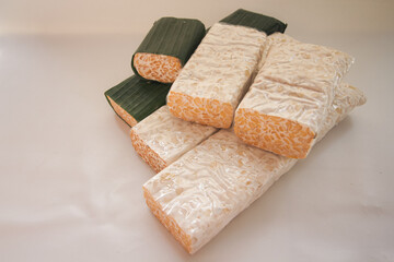 tempeh Tempe is Indonesian traditional food made from fermented soybeans. They are usually wrapped in banana leaves.
