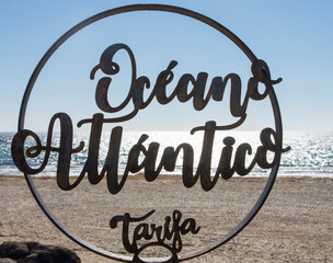 A view of an iron signal in Tarifa with Oceano Atlantico letters