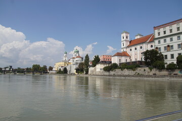 View from a sightseeing boat at the German city of Passau with the St. Stephen's Cathedral. Sailing on the Inn River. Summer, August, Germany.