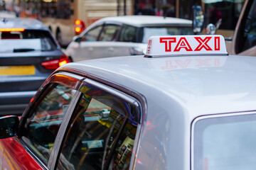 Red cab taxi in a street downtown in Central Hong Kong.
