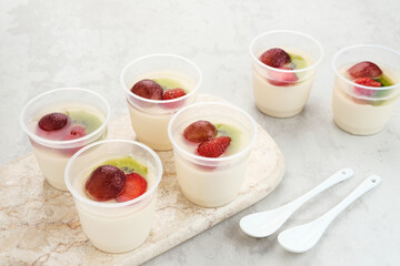 Fruity Milk Pudding, sweet vanilla silk pudding dessert with strawberry, grape and kiwi fruit topping
