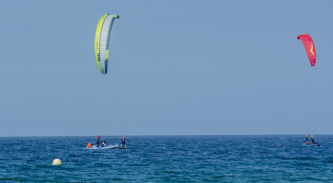 Kite-surfing. Many silhouettes of kites in the sky. Holidays on nature. Artistic picture. Beauty world. 