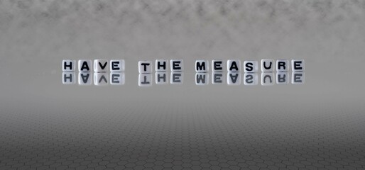 have the measure word or concept represented by black and white letter cubes on a grey horizon...