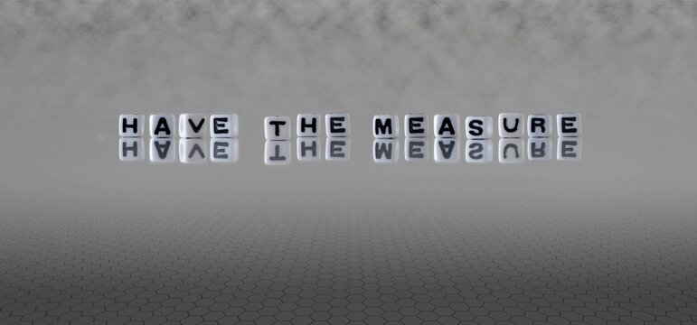 have the measure word or concept represented by black and white letter cubes on a grey horizon background stretching to infinity
