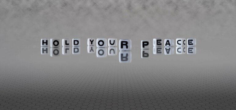 hold your peace word or concept represented by black and white letter cubes on a grey horizon background stretching to infinity