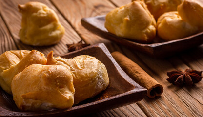 Profiteroles stuffed with cream, homemade bakery. close up