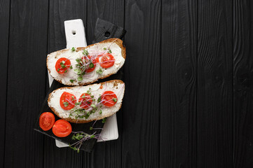 Toasts with microgreens on the table. Healthy food, vegan food and dieting concept.