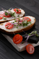 Toasts with microgreens on the table. Healthy food, vegan food and dieting concept.