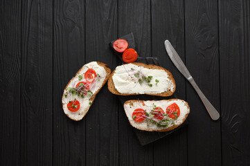 Toasts with microgreens on the table. Healthy food, vegan food and dieting concept.