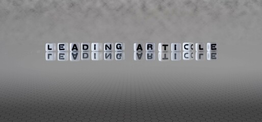leading article word or concept represented by black and white letter cubes on a grey horizon background stretching to infinity