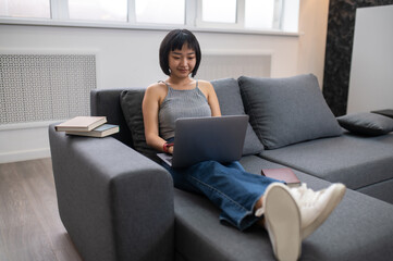 Short-haired cute young girl styding online