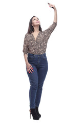 in full growth. attractive young woman with a smartphone.