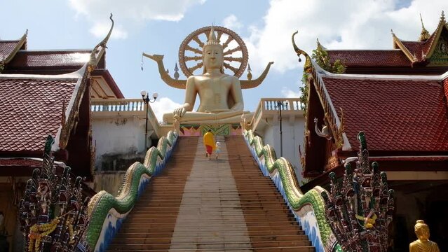 KO SAMUI, THAILAND - FEBRUARY 26, 2020: Stairs to the Statue of big Golden Buddha, Wat Phra Yai temple on koh Samui, Thailand.