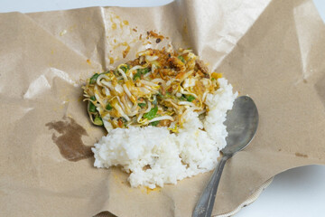 Karedok with rice, a traditional Sundanese dish from Indonesia, featuring fresh raw vegetables with...