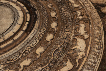 Moonstone or Sandakada Pahana, is a unique feature of the architecture of ancient Sri Lanka.It is an elaborately carved semi-circular stone slab, usually placed at the bottom of staircase. 