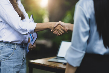 Fototapeta premium Business women shake hands with colleagues and business partners cooperation.