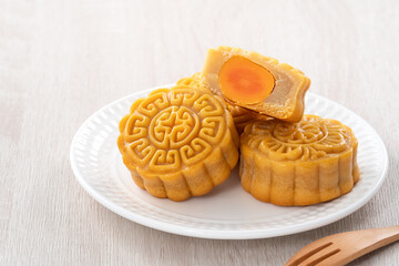 Delicious Cantonese moon cake for Mid-Autumn Festival food mooncake on wooden table background.