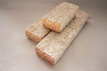 tempeh Tempe is Indonesian traditional food made from fermented soybeans. They are usually wrapped in banana leaves.