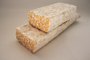 tempeh Tempe is Indonesian traditional food made from fermented soybeans. They are usually wrapped in banana leaves.