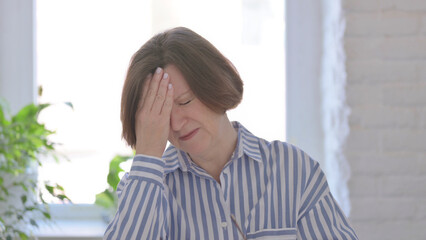 Portrait of Senior Woman having Headache