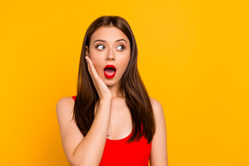 Photo of impressed shocked lady dressed bodysuit arm cheek looking empty space isolated yellow color background
