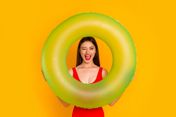 Photo of shiny flirt woman wear swimsuit winking looking inside buoy isolated yellow color...