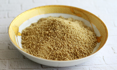 Instant tiwul on a plate. Ready to cook. Tiwul is a traditional Indonesian food that used to be a staple substitute for rice. 