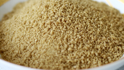 Instant tiwul on a plate. Ready to cook. Tiwul is a traditional Indonesian food that used to be a staple substitute for rice. 