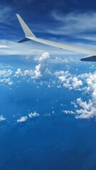Fototapeta premium View from an Airplane during flight with clouds
