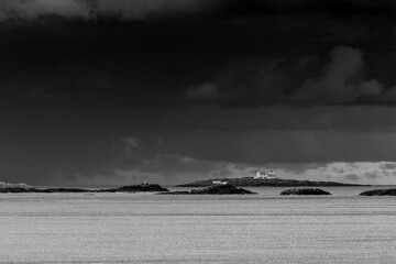 Lighthouse under heavy clouds