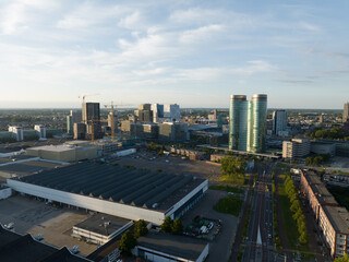 Naklejka na ściany i meble Utrecht skyline and central station public transport infrastructure and business district. Aerial drone overhead view. Tall buildings and towers downtown. Hoog Catharijne shopping center.