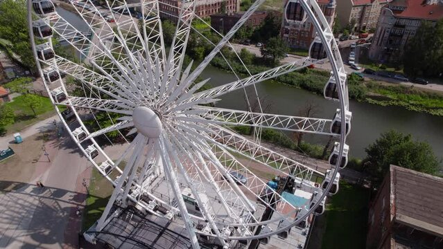 Backward flight from the Ferris wheel in the old town of Gdansk, Poland, 4k