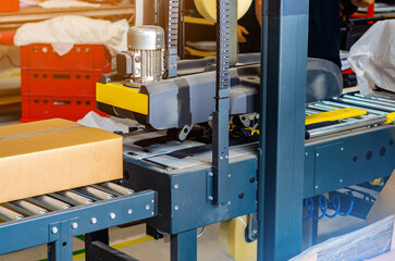 Cardboard packaging machine. Production line of packaging. Industry.