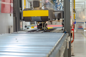 Front view cardboard packaging machine. Production line of packaging. Industry.