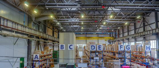 Assembly shop in production. Plant for the manufacture of lighting devices. Panoramic photo.