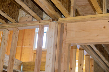 Fototapeta na wymiar Wood framing beams stick framing building of new house under construction on built home