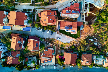 Aerial top view of the red roofs of houses