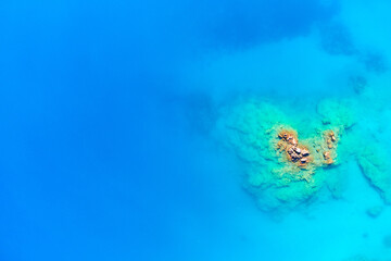 Top view of the turquoise blue mediterranean sea with corals