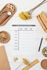 Desktop with goal setting template and office accessories. Organization, time managing,...