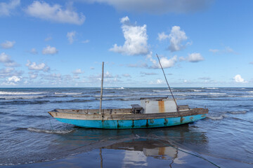 boat on the beach in the city of Ilheus, State of Bahia, Brazil