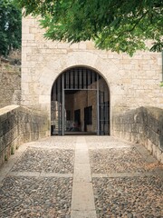 Vertical view of a Stone bridge in the Sant Pere de Galligants leading to the entrance